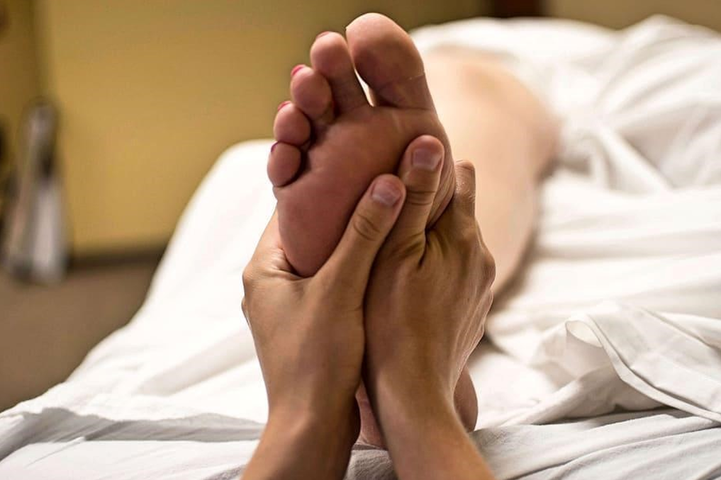 Reflexology foot treatment in progress